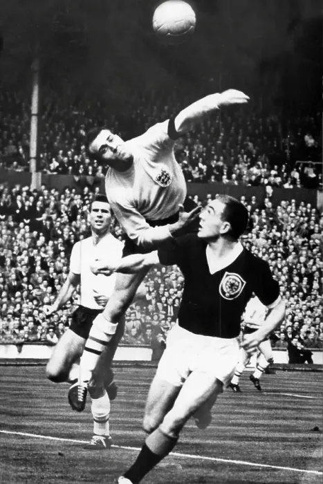 Framed Print : Ron Springett (England) saves from Ian St John of Scotland in 1961 Framed Print : Ron Springett (England) saves from Ian St John of Scotland in 1961