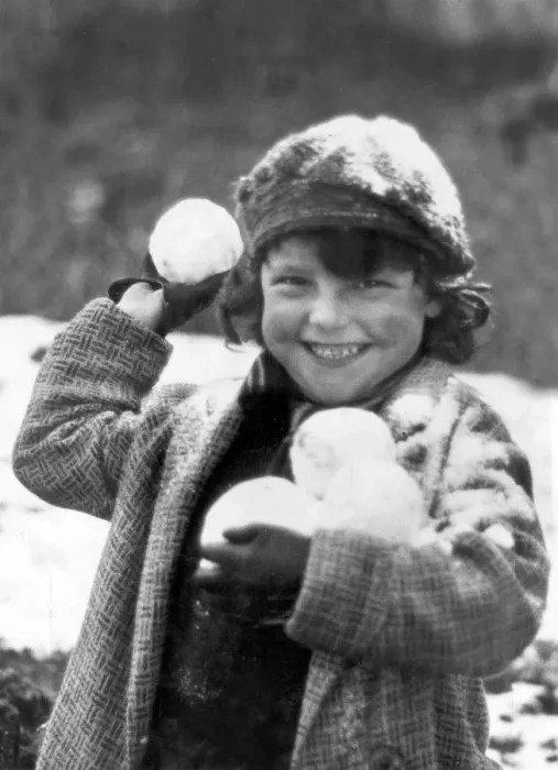 Framed Print : Snowball. A small child, wrapped up against the cold in Penrhos Framed Print : Snowball. A small child, wrapped up against the cold in Penrhos