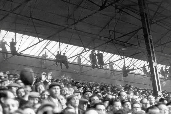 Southampton fans hang from the rafters to watch their side host Nottingham Forest in the FA Cup in 1963
