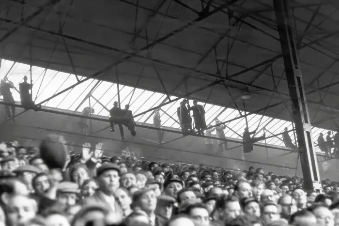 Framed Print : Southampton fans hang from the rafters to watch their side host Nottingham Forest in the FA Cup in 1963 Framed Print : Southampton fans hang from the rafters to watch their side host Nottingham Forest in the FA Cup in 1963
