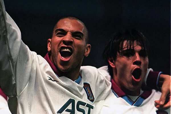 Stan Collymore and Savid Milosevic celebrate scoring in the UEFA cup against Bucharest