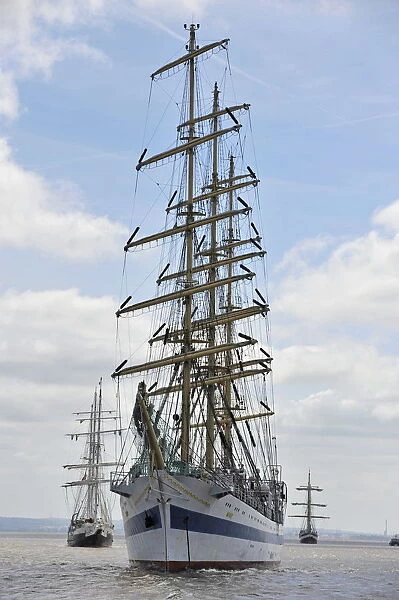 Tall Ships sail out of the river Mersey at Liverpool