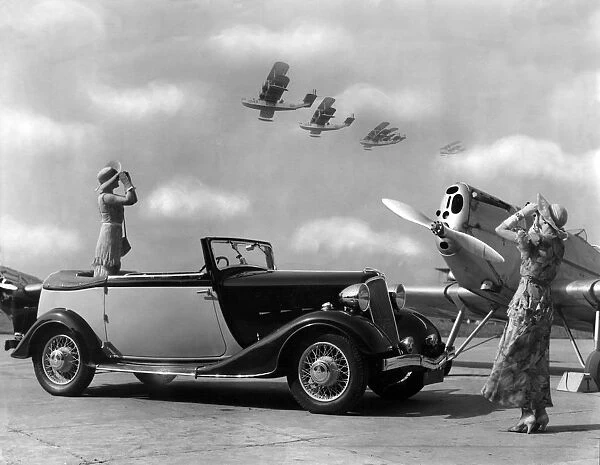 Thirties motoring. Four Seater Renault Airline Drop Head Coupe, on an airfield, 1934