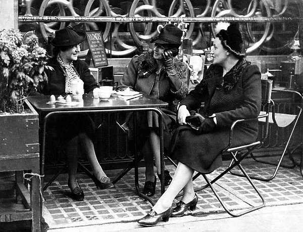 Time for Coffee. A group of women enjoy a coffee outside a cafe on Regent Street in 1938