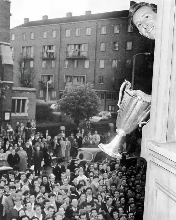 Framed Print : Tony Marchi waves the European Cup Winners Cup trophy from the Tottenham boardroom window 1963 Framed Print : Tony Marchi waves the European Cup Winners Cup trophy from the Tottenham boardroom window 1963