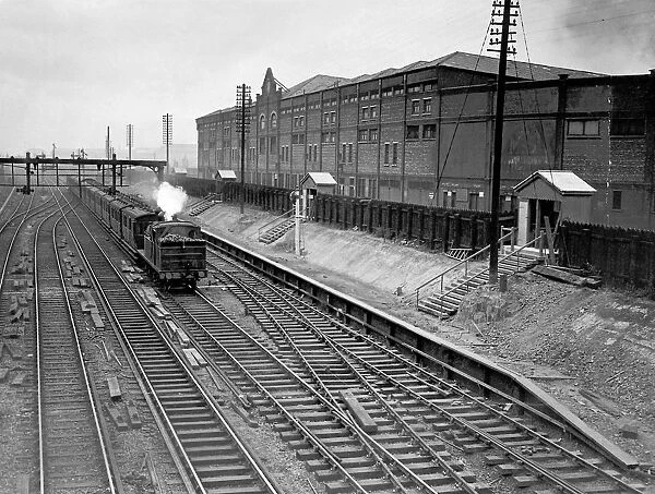 Train passing Manchester United Football Ground, 1935