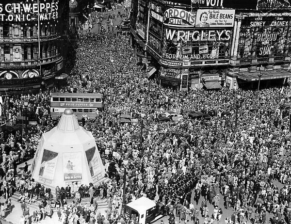VJ Day celebrations in London, crowds gathered in Piccadilly Circus and Shaftesbury Avenue