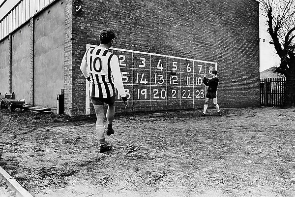 West Bromwich Albion inside forward John Kaye practises scoring against a numbered wall