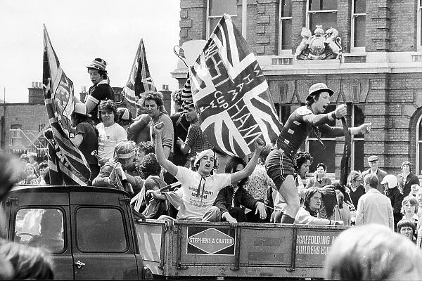 West Ham United players celebrate through the streets of the East end of London after winning the FA Cup 1975