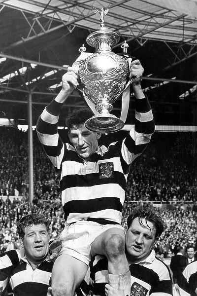Widnes captain Vik Karalius holds trophy aloft after victory over Hull Kingston Rovers in Rugby League Cup Final 1964