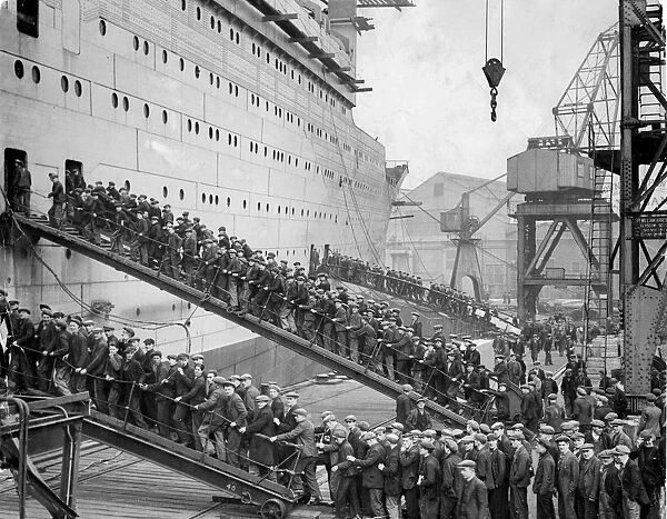 Workers board the Queen Mary