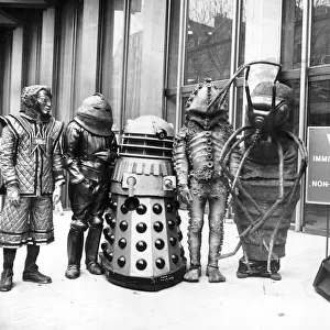 Actor Tom Baker as Dr Who, with his robot dog K-9, and assorted friends at the US Embassy 1978
