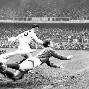 Andy Mulligan (dark shirt) passes the ball in the Ireland v England (0-3) match at Lansdowne Road in the Five Nations Championship 1959 Andy Mulligan (dark shirt) passes the ball in the Ireland v England (0-3) match at Lansdowne Road in the Five Nations Championship 1959