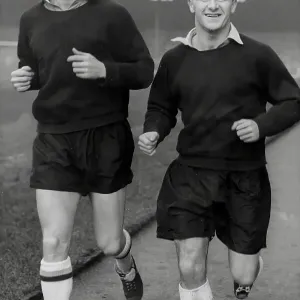 Arsenal players David Herd and Tommy Docherty training Arsenal players David Herd and Tommy Docherty training