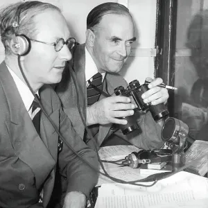 Black and white print of two men commentating on a cricket match Black and white print of two men commentating on a cricket match