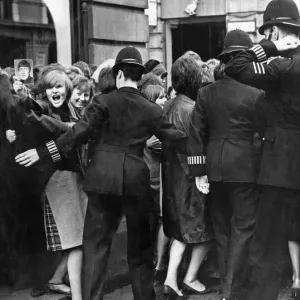 Print of Beatles fans waiting at the London Palladium Print of Beatles fans waiting at the London Palladium