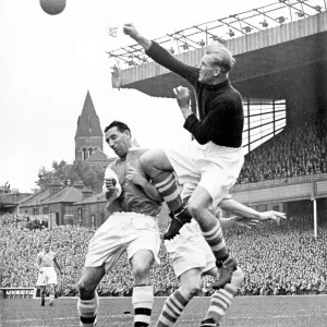 Bert Trautmann, Manchester City Goalkeeper clears the ball from Tommy Lawton of Arsenal Bert Trautmann, Manchester City Goalkeeper clears the ball from Tommy Lawton of Arsenal