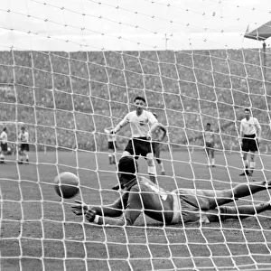 Brazil goalkeeper Gilmar dos Santos Neves saves a penalty from England's Roger Byrne