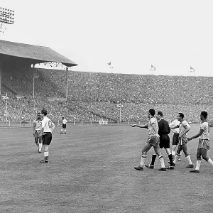 Brazil's number 8, Alvaro Valente, walks away with the ball followed by his team-mates and the referee after a penalty was awarded Brazil's number 8, Alvaro Valente, walks away with the ball followed by his team-mates and the referee after a penalty was awarded