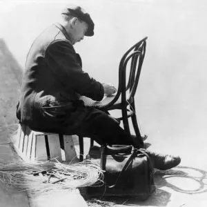A chair mender in Kensington 1935 A chair mender in Kensington 1935