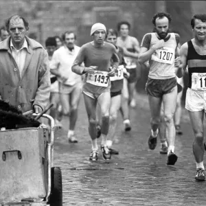 Competitors in the first London Marathon in March 1981 run past an unimpressed street cleaner Competitors in the first London Marathon in March 1981 run past an unimpressed street cleaner