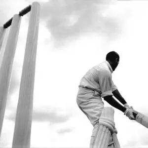 Black and white print of Basil D Oliveira in mid-cricket action Black and white print of Basil D Oliveira in mid-cricket action
