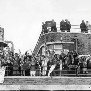 Crowds greet the Liverpool team from rooftops at Liverpool Airport, after winning Football League Cup and UEFA Cup, 1976 Crowds greet the Liverpool team from rooftops at Liverpool Airport, after winning Football League Cup and UEFA Cup, 1976