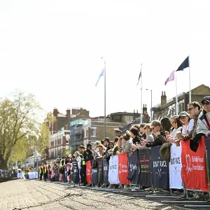 Crowds watch the race from the banks of the Thames Crowds watch the race from the banks of the Thames