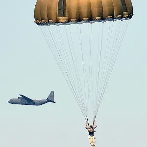 D-Day 70th Anniversary commemorations. - Paratroop drop over wheat field at Ranville, Normandy, France