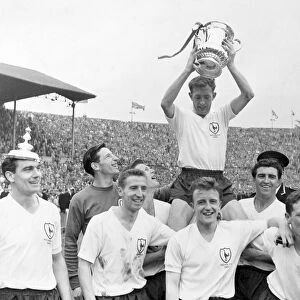 Danny Blanchflower holding the FA Cup aloft