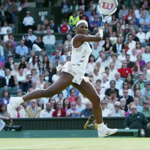 Defending champion Serena Williams in the semi-final of the Ladies Singles tournament of The Lawn Tennis Championships at Wimbledon 2004 Defending champion Serena Williams in the semi-final of the Ladies Singles tournament of The Lawn Tennis Championships at Wimbledon 2004