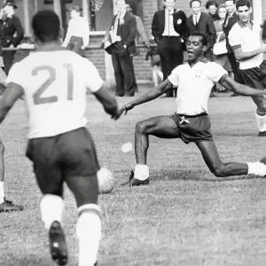 Denilson passes the ball to Pele during Brazilian football team training session for the 1966 World Cup Denilson passes the ball to Pele during Brazilian football team training session for the 1966 World Cup