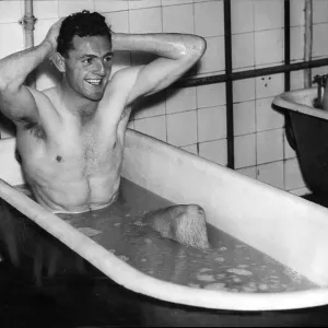 Eddie McMorran, Manchester City footballer taking a bath after training Eddie McMorran, Manchester City footballer taking a bath after training