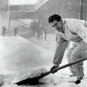 Emilio Aldecoa Birmingham City trainer clearing snow from pitch Emilio Aldecoa Birmingham City trainer clearing snow from pitch