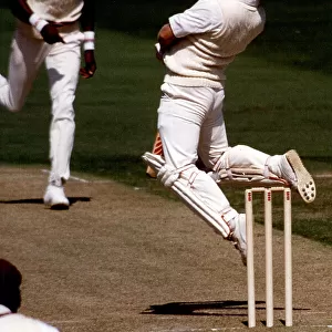 England's Hugh Morris avoids another bouncer from Curtly Ambrose