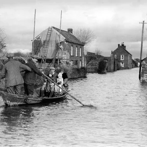 Flood in Athenley, Somerset, with a boat floating down main street, 1929 Flood in Athenley, Somerset, with a boat floating down main street, 1929