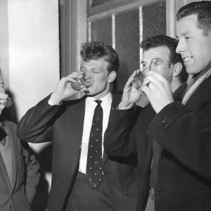 Footballers taking anti-flu medicine, 1961 Print