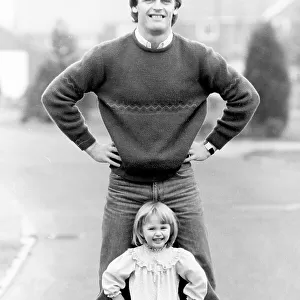 Gordon McQueen, former Manchester United footballer and television pundit is pictured with his daughter Hayley McQueen in 1983