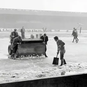 Groundsmen attempting to rid the pitch of ice at Anfield, during the bad winter of 1962/1963 Groundsmen attempting to rid the pitch of ice at Anfield, during the bad winter of 1962/1963