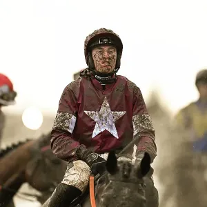 Harry Swan in the muddy last race on the Thursday evening in the last light of the day Cheltenham Festival week Harry Swan in the muddy last race on the Thursday evening in the last light of the day Cheltenham Festival week