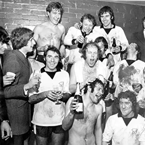Hereford players celebrate in the dressing room after beating Newcastle