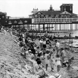 Holidaymakers on the beach by Bognor Regis pier 1935