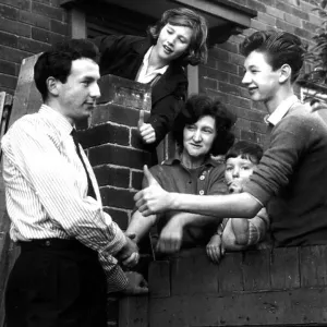 Huddersfield footballer Mike O'Grady is congratulated by neighbours at his Leeds home after being capped for England Huddersfield footballer Mike O'Grady is congratulated by neighbours at his Leeds home after being capped for England