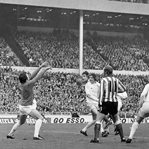 Ian Porterfield's (right) shot flies over Leeds goalkeeper David Harvey to score the goal that gave 2nd division Sunderland a miraculous victory against the favourites