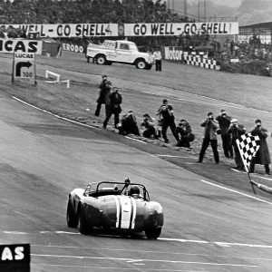 Jack Sears in his AC Cobra at Brands Hatch taking the winners flag 1964 Jack Sears in his AC Cobra at Brands Hatch taking the winners flag 1964