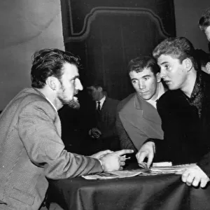Jimmy Hill, chairman of the footballers union, the P. F. A. talking with Aston Villa players