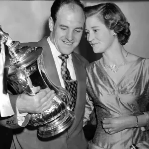 Jimmy Scoular and wife Joyce admiring the FA Cup trophy print