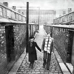 Kazimierz Deyna Polish footballer with his wife Mariola, on a street in front of Manchester City Football Ground, Maine Road 1978