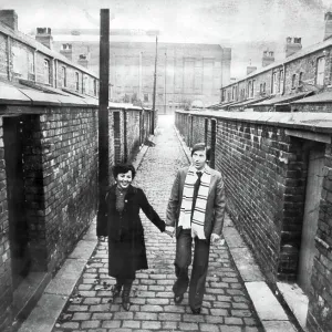 Kazimierz Deyna Polish footballer with his wife Mariola, on a street in front of Manchester City Football Ground, Maine Road 1978