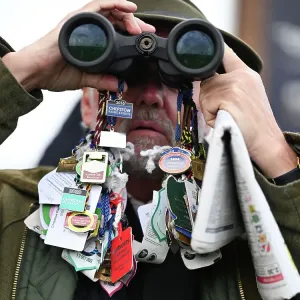 The King George V1 Chase Kempton Park A punter watching the races The King George V1 Chase Kempton Park A punter watching the races